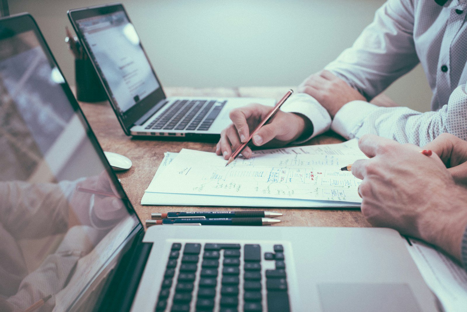 Business professional reviewing a plan with a pen